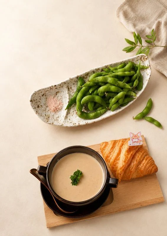Edamame and cream of mushroom soup with a croissant